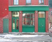 This photograph shows the storefront  and two entrances of the building, 2005; City of Saint John