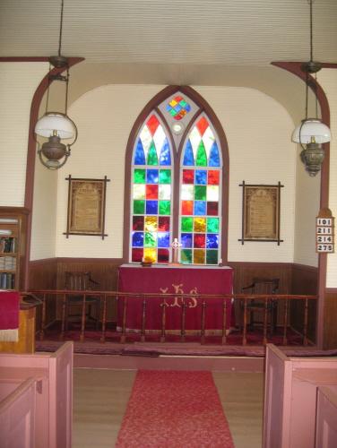Showing interior with stained glass window