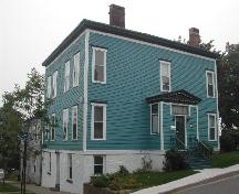This photograph shows the contextual view of the residence, on the corner of Germain Street and Pagan Place, 2005; City of Saint John