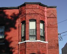 This photograph shows the roof-line cornice and illustrates some of the brick detail, 2005; City of Saint John