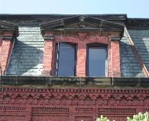 This photograph shows the pedimented  dormers and the elaborate brick detail at the cornice, 2005; City of Saint John