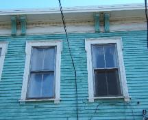 This photograph shows the roof-line cornice, 2005; City of Saint John