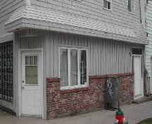 This image provides a view of the store front cornice and corner entrance, 2005; City of Saint John