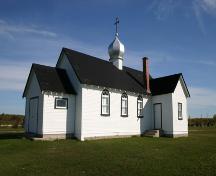 View, from the southwest, of the main elevations of the Ukrainian Catholic Church of the Blessed Virgin Mary, Malonton area, 2004.; Historic Resources Branch, Manitoba Culture, Heritage, Tourism and Sport, 2005
