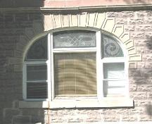 View of decorative window and stone trim on east side of building, 2008.; Herrington, 2008.