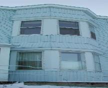 This image provides a view of the two-storey, off-centered bay window, 2006; City of Saint John