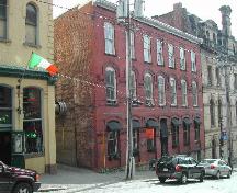 This photograph shows the contextual view of the building and its proximity to the other buildings on the slope of Princess Street, 2004; City of Saint John