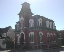 This photograph illustrates the contextual view of this landmark corner residence, 2007; City of Saint John