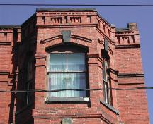 This photograph illustrates the cornice of the building, 2007; City of Saint John