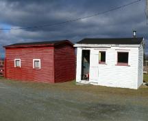 View of the right facade of Metcalfe Shed and the front facade of Metcalfe Office, Chamberlains, Conception Bay South, NL. Photo taken 2009. ; HFNL/Andrea O'Brien 2009