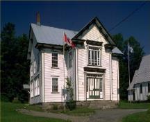 General view of Bolton-Est Town Hall, showing the wood frame construction and white painted clapboard siding.; Parks Canada Agency / Agence Parcs Canada.