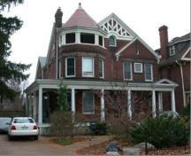 Of note is the wrap-around veranda and corner tower with conical roof.; City of Brantford, nd.