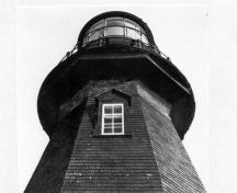 General view of the Lighthouse, showing the sturdy timber and frame construction, 1980.; Parks Canada Agency / Agence Parcs Canada,  Dudley Witney, 1975.