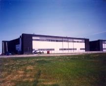 View of the Royal Canadian Air Force Hangar 8, showing the high sliding interlocking doors, 1998.; Department of National Defence / Ministère de la Défense nationale, 1998.
