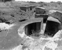 View of the Gun Emplacement, Magazine and Crew Shelter 1, showing the gun platform and issuing hatches, 1996.; Agence Parcs Canada / Parks Canada Agency, 1996.