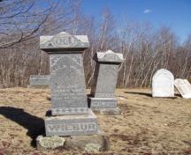 This image shows the tombstones of several generations of the Wilbur family; Moncton Museum