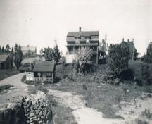 Historic view of the George W. Crawford House property, taken from near the shoreline.; Crawford family