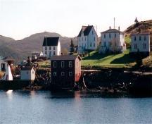 View of Petite Forte Harbour with Patrick Hayden Residence located in the background, noted by its steeply pitched roof with single front peak. Photo taken 1999.; © HFNL 2006