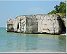 View from the water of Steep Rock Cliffs, Steep Rock, 2013; Historic Resources Branch, Manitoba Tourism, Culture, Heritage, Sport and Consumer Protection, 2014