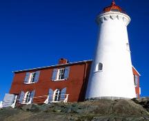 Low angle shot of Fisgard Lighthouse and attached dwelling; Parks Canada Agency | Agence Parcs Canada