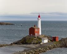 General view of Fisgard Lighthouse showing the related buildings : a replica boathouse and a replica storehouse; Parks Canada Agency | Agence Parcs Canada, 2011.