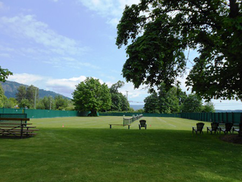 Exterior view of grass courts and view of Cowichan Bay, 2015