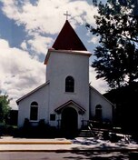 Front view of the chapel, showing its steepled entry tower, 1986.; Royal Canadian Mounted Police / Gendarmerie royale du Canada, 1986.