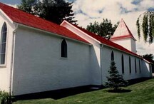 Side view of the chapel, showing the regularly arranged tall, pointed windows, 1986.; Royal Canadian Mounted Police / Gendarmerie royale du Canada, 1986.